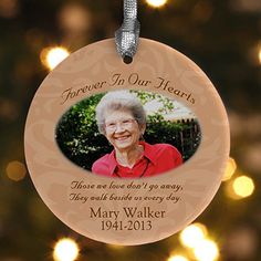 a memorial ornament hanging from a christmas tree