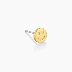 Perfect for first, second or third piercings, stud earrings were designed to be worn in multiples. This smiley charm stud earring is perfect paired with gold hoop earrings or other stud earrings. Product Details 1/4" in diameter and 1/16" thick Surgical steel post back Available in 18k gold plated brass Avoid contact with anything containing derivatives of alcohol Sold individually | Smiley Charm Stud Earring in Gold/Smiley, Women's by gorjana Trendy Yellow Gold Cartilage Earrings As Gift, Trendy Nickel Free Gold Piercings, Trendy Nickel-free Gold Piercings, Trendy Gold Piercings For Gift, Trendy Yellow Gold Cartilage Earring, Trendy Gold Hypoallergenic Piercings, Trendy Yellow Gold Single Cartilage Earring, Trendy Tiny Gold Cartilage Earrings, Trendy Gold Internally Threaded Earrings