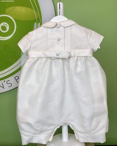 An elegant one-piece bubble outfit for baby, unisex. It is made in off-white organza with laces. It has buttons on the back and bottom for closure. Ideal to wear at any special occasion. Made in Portugal Handwash or Dry Clean Final Sale, no exchanges nor returns will be available White Short Sleeve Bubble Romper For Baptism, Elegant White Bubble Romper For Spring, White Fitted Bubble Romper For Baptism, Bubble Onesie, Bubble Outfit, Bubble Clothes, Christening Outfit, Baby Unisex, Miami Fl