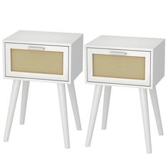 two white wooden side tables with wicker inserts on each end and one drawer