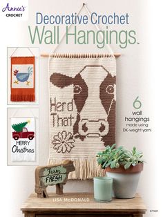 an advertisement for wall hangings featuring a cow