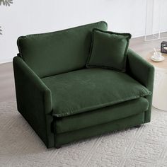 a green chair sitting on top of a white rug