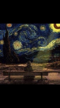 a bench sitting in front of a painting on the wall