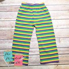 These cotton pants are perfect for the Mardi Gras Season fastly approaching! Ask about our raglans too! Green Cotton Leggings For Spring, Multicolor Straight Leg Bottoms With Elastic Waistband, Stretch Striped Cotton Pants, Multicolor Long Pants With Elastic Waistband, Yellow Stretch Pants With Elastic Waistband, Cotton Leggings With Elastic Waistband, Casual Green Cotton Leggings, Multicolor Cotton Bottoms With Elastic Waistband, Multicolor Cotton Sweatpants With Elastic Waistband