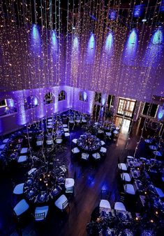 an overhead view of a banquet hall with purple lighting