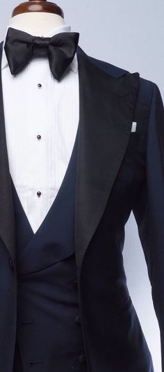 The classic navy tuxedo is a staple of any man's wardrobe. This elegant single-breasted Evening Wear tuxedo is tailored slim from soft, mid-weight, true blue mohair, and features our signature one-button placement, double vents, jetted pockets, natural shoulder, and wide peak lapels in grosgrain. The accompanying slim trousers are flat front with a wide waistband and feature our versatile side adjusters and classic tuxedo stripe. Navy Blue Tuxedo, Blue Tuxedo Jacket, Red Overcoat, Brown Chukka Boots, Mens Wedding Suits, Navy Tuxedos, Blue Tuxedo, Grey Overcoat, Navy Blue Tuxedos