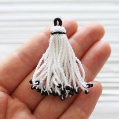 White tassel with black glass beads, earrings tassel, tassel pendant, short white tassel, optic white tassel, necklace tassel, cotton mix,N1 L: 50 mm Please choose the quantity you want! Would you like to see silk tassels? Please check out the link below: https://www.etsy.com/shop/EastVillageSupply?ref=hdr_shop_menu%C2%A7ion_id%C2%A7ion_id&search_query=silk+tassel Would you like to see more ivory/white jewelry findings? Just click the link below: https://www.etsy.com/shop/EastVillageSupply?r White Fringe Tassel Earrings As Gift, White Tassel Earrings Gift, Handmade White Tassel Necklace As Gift, Handmade White Tassel Necklace For Gift, Gift White Tassel Earrings, Chinese Knots, Silk Tassels, White Tassel, Beads Earrings