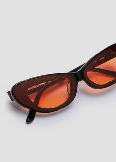 Slim cat-eyed acetate frame with unique Infinity Lenses. Metal Love Note detailing on temples. Black frames with orange lenses. Love Notes, Orange Black, Black Frame, Sale Items, Lenses, Shades, Black