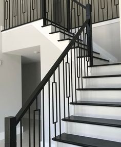 a black and white staircase in a house