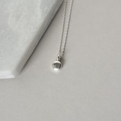 A dainty minimalist accessory that's perfect for everyday wear! This necklace features a tiny sterling silver pebble charm paired with sterling silver cable chain. The small disc is 5mm wide and about 2mm thick and it has a sleek bright polish that gives the necklace a modern feel. The simple design makes this a versatile accessory and it looks chic alone or layered with others. The necklace is fastened with a sterling silver spring ring clasp and you can choose your desired length from the drop-down menu above. You can find lots more minimalist necklaces here: www.etsy.com/ca/shop/juliegarland/search?search_query=minimalist+necklace And to return to the store: www.etsy.com/ca/shop/juliegarland SAVE 10% on your Etsy purchase today when you become an insider: https://www.juliegarlandjewelry Dainty Silver Charm Necklaces For Everyday, Simple Round Pendant Charm Necklace For Everyday, Dainty Small Charm Necklace For Everyday, Minimalist Nickel Free Charm Necklaces For Everyday, Minimalist Nickel-free Charm Necklaces For Everyday, Minimalist Tiny Charm Necklaces For Everyday, Silver Minimalist Charm Necklaces For Everyday, Silver Minimalist Charm Necklace For Everyday, Silver Minimalist Charm Necklaces