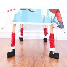 a person in red boots standing under a table