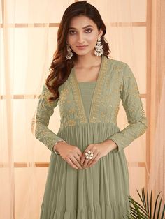 This elegant Green Sequins and Embroidered Tiered Maxi Dress features a floral embroidered design, fit and flare shape, and a flattering V-neckline. Its long regular sleeves and flared hem add a touch of sophistication, while the slip-on closure allows for easy dressing. Perfect for any formal occasion, this dress is a Maxi Dress Sale, Eid Collection, Easy Dressing, Green Sequins, Tiered Maxi Dress, Embroidered Design, Comfortable Outfits, Flared Sleeves, Simple Dresses