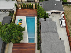 an aerial view of a house with a swimming pool