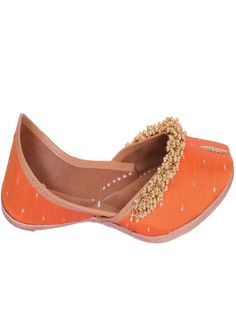 Orange fabric juttis with Gold tiny ghunghroos add a touch of flirty fun to your ensemble with their handiwork and floral pattern. Wear it with a purple and gold sharara set to a friend’s wedding. Color: Orange Fabric: Upper- Silk Embroidered fabric with gold tiny ghungroos, Inner - leather lining cushion for extra comfort & pure leather sole Note: Available in other colors Heel type - Flat The product will be shipped within 20-25 days of the order placed Care intructions - Keep in dust bag, dry Handwork Flats For Festive Summer Occasions, Festive Summer Slip-on Flats, Summer Festive Slip-on Flats, Festive Zari Work Flats For Summer, Traditional Flats With Zari Work For Summer, Closed Toe Flats For Festive Summer Occasions, Closed Toe Flats For Festive Summer Events, Closed Toe Flats For Summer Festivals, Festive Spring Slip-on Flats