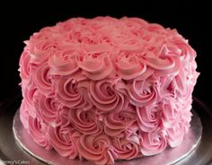 a cake with pink frosting roses on it