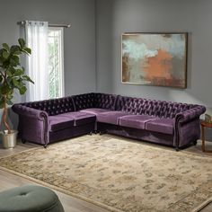 a living room filled with furniture and a rug