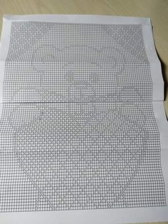 a piece of paper that has been cut into squares and lines on top of it