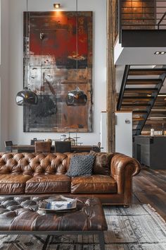 a living room filled with furniture and a staircase