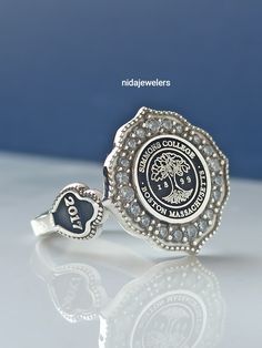 This product is GUARANTEED for life. * College graduation rings for men and women delicately engraved with your school logo or any other initials or image you want. * The ring has solid back. Deep and detailed engraving very delicately handcrafted unisex - looks super cool on both women & men * The ring is 925 Silver * Please contact me for your 14 carat and 18 carat solid gold requests. I can gladly do. * Certified 14k solid gold, hallmarked 14k for solid gold rings. * The ring has solid ba Graduation Rings College, Class Rings College, College Ring, University Rings, Graduation Ring, Family Crest Rings, College Rings, Custom Signet Ring, Graduation Rings