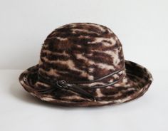 "Size 53 cm - 20,86\" Brim 9 cm - 3,54\"(at the widest) Very good vintage condition 7" Retro Brown Hat Bands For Winter, Vintage Brown Fedora With Short Brim, Fitted Vintage Brown Hat Bands, Brown Vintage Flat Brim Hat, Vintage Brown Brimmed Fedora, Brown Vintage Fedora With Flat Brim, Vintage Brown Cloche Hat For Winter, Vintage Brown Fedora Hat, Vintage Brown Adjustable Hat Band