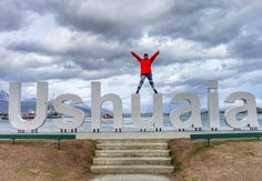 a person jumping in the air with their arms wide open and hands up above them