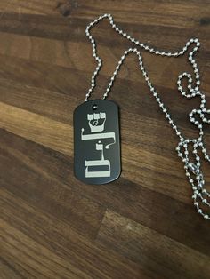 Dog tag charm with Shalom in Hebrew laser engraved on it.  Can be customized with name and engraved on black or blue. Chain included.  All items are created custom and finished product may vary as they are all unique. Dog Tag, Tag Necklace, Laser Engraved, Dog Tags, Dog Tag Necklace, Pendant Necklaces, Laser Engraving, Lawn, Pendant Necklace