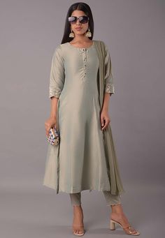 This attire with Cotton Lining is Enhanced with Buttons, Stone and Zari Work. Crafted in Round Neck and Quarter Sleeve, Available with a Cotton Silk Pant with elastic closing and a Faux Chiffon Dupatta. The Kameez and Bottom Lengths are 48 and 36 inches respectively Do note: Accessories shown in the image are for presentation purposes only and length may vary upto 2 inches.(Slight variation in actual color vs. image is possible). We sell all kinds of salwar kameez sets for women Georgette Salwar Kameez | Crepe Salwar Kameez | Art Silk Salwar Kameez | Velvet Salwar Kameez | Chiffon Salwar Kameez | Net Salwar Kameez | Zari Work Salwar Suits | Indian Festival Wear Suits | Indian Wedding Outfit | Indian Party Wear Dresses | Indian Dresses On Discount | Indian Traditional Salwar Kameez | Ethnic A Line Kameez, Silk Suit Designs Indian, Salwar Suit Pattern, Party Wear Dresses Indian, Indian Party Wear Dresses, Wedding Outfits Indian, Suit Neck Designs, Suits Indian, Vs Image