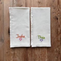 two personalized hand towels with hearts on them