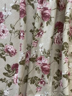 the fabric has pink flowers on it