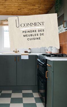 a kitchen with green cabinets and a white sign hanging from the ceiling that says comment