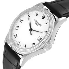 Patek Philippe Calatrava White Gold Automatic Mens Watch 5117. Automatic self-winding movement. 18k white gold case 37.0 mm in diameter. Transparent exhibition sapphire crystal caseback. 18k white gold hobnail bezel. Scratch resistant sapphire crystal. White dial with black Roman numerals. Date calendar window at 3 o'clock. Black leather strap with 18K white gold tang buckle. White Timeless Diamond Watch With Chronometer, Timeless White Diamond Watch With Chronometer, Luxury White Watch Accessories With Date Indicator, Timeless White Gold Watch Bands For Formal Occasions, Luxury White Diamond Watch With Chronometer, Designer Chronometer Watch In White Gold, Designer White Gold Chronometer Watch, Classic Diamond Watch With Skeleton Dial, Classic Round Diamond Watch With Skeleton Dial