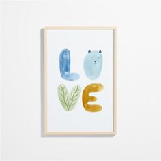 an art print with the word love written in watercolor and painted on to it