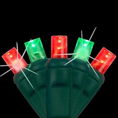 green and red christmas lights on top of each other