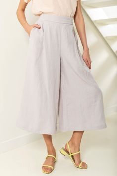 "Linen culotte pants with pockets. These drapey cullotes have flared cut, elastic back waist and pockets in side seams. Their legs are wide but not too wide to look like a skirt. You would love these flowy culottes, if you like unrestricted movement. Mid-calf length and relaxed silhouette make them a perfect pick for various casual occasions. ABOUT US LINEN ID was born from desire to embrace things that actually matter. We aim to create sustainable garments that offer uncompromised design, are v Festival Trousers, Linen Culottes, Pants Linen, Palazzo Trousers, Culotte Pants, Boho Pants, Wide Leg Linen Pants, Pants With Pockets, Linen Pants Women