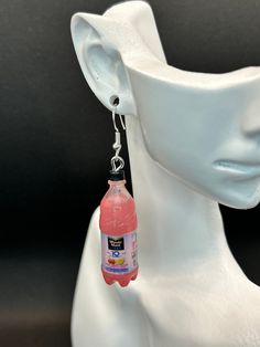 Who doesn't think of pink lemonade when it's summertime? These adorable pink lemonade bottle earrings are perfect for any earring collection  Each pink lemonade bottle dangles from a hypoallergenic hook These are a little on the heavier side but not to heavy  Each bottle of lemonade is approximately 1 1/2 x 1/2 inch  Please note these are not real drinks they are made from toys Lemonade Bottle, Lemonade Juice, Bottle Earrings, Earring Collection, Pink Lemonade, Earrings Collection, Summer Time, Lemonade, Jewelry Earrings Dangle