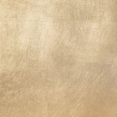 an image of a gold background that looks like it has been brushed