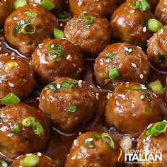 meatballs covered in sauce and garnished with green onions