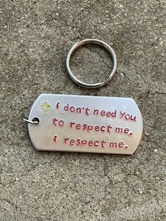 a metal keychain that says i don't need you to respect me, i respect me