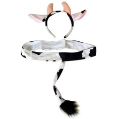 a black and white cow print hat with two horns on it's headband