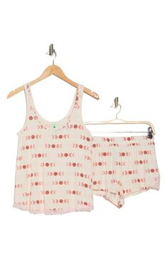 Stay chic and cozy in these palm patterned pajamas that pair a breezy tank and shortie shorts. Top: 24.25" length (size Small); pants: 14.5" leg opening; 11.5" front rise; 14.5" back rise (size Small)
 Top has scoop neck, tank straps Bottoms have elastic banded waist 95% rayon, 5% spandex Machine wash cold, lay flat to dry Imported Model stats: 5'10", 32" bust, 25" waist, 36" hip. Model is wearing size Small.