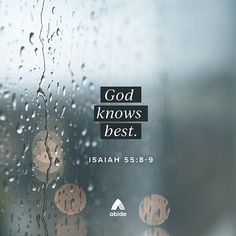 the words god knows best are displayed on a window with raindrops and blurry lights