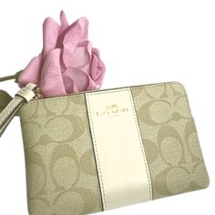 Coach Wristlet Corner Zip In Signature Canvas Signature-Coated Canvas With Crossgrain Leather Details Two Credit Card Slots Zip-Top Closure, Fabric Lining Wrist Strap Attached 6 1/4" (L) X 4" (H) X 1/2" (W) C1010 Beige Clutch With Wrist Strap For Gift, Beige Clutch With Wrist Strap As Gift, Chic Beige Bags With Wrist Strap, Elegant Beige Bag With Wrist Strap, Elegant Beige Bags With Wrist Strap, Elegant Beige Clutch Wristlet, Elegant Beige Clutch With Wrist Strap, Coach Beige Pouch Wristlet, Beige Coach Pouch Wristlet