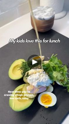 an avocado is being drizzled with mayonnaise and garnish