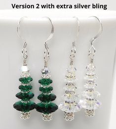 "Sparkling Earrings made from Swarovski Beads in Emerald or Crystal AB (Clear with iridescent coating) on sterling silver French ear wires. Made with silver accents and base make this a sparkling holiday accessory. The silver accents are silver plated. Version 2 adds a little extra silver sparkle and 1/8\" to the length. Really pretty! Makes a beautiful gift that is perfect for the holidays. Length including ear wire is approximately 1.25\" (version 2 is a tad longer). Please convo us with any q Holiday Silver Jewelry With Ear Wire, Silver Crystal Beaded Earrings For Gift, Handmade Silver Holiday Earrings, Sterling Silver Beaded Crystal Earrings For Gift, Sterling Silver Crystal Beaded Earrings For Gift, Silver Round Beads Jewelry For Christmas, Sterling Silver Crystal Earrings With Round Beads As Gift, Gift Sterling Silver Wire Wrapped Beaded Earrings, Silver Jewelry With Round Beads For Holidays