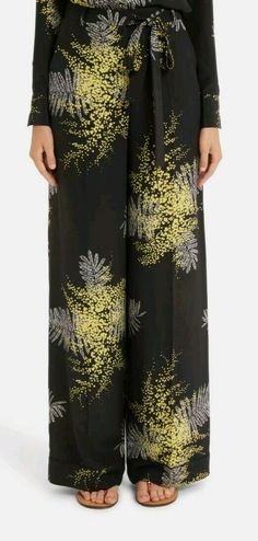 VALENTINO Mimosa Print Silk Wide Leg Pants, Size 38( US 2), $1980.00, NWT. Silk pants are brand new, and in perfect condition. They will come with tags attached, and wrapped in plastic. SIZE INFO True to size. High rise. DETAILS & CARE Bright mimosa flowers signal a fresh season for these silk crêpe de Chine pants tailored with a relaxed wide-leg silhouette and waist-defining tie belt. Zip fly with tie closure Front slant pockets; back button-welt pockets 100% silk Dry clean Made in Italy Item # Luxury Multicolor Bottoms With Elastic Waistband, Mimosa Flowers, Valentino Silk, Silk Wide Leg Pants, Mimosa Flower, Silk Pants, Silk Crepe, Mimosa, Tie Belt