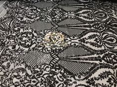 black and white lace fabric with floral design on the bottom, it is very soft