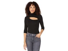 LAmade Peekaboo Turtleneck - Women's Clothing : Black : Turn heads with your poised fashion choice by wearing the LAmade Peekaboo Turtleneck top. Slim fit top in a turtleneck silhouette. Three-fourth fitted sleeves with raglan seams. Cutout accent just below the neckline. Rib-knit pattern throughout. Straight hemline. Pull-on construction. 95% MicroModal, 5% spandex. Machine wash, dry flat. Made in the USA. Measurements: Length: 23 in Product measurements were taken using size SM. Please note th Modern Mock Neck Top For Fall, Trendy Mock Neck Top For Spring Workwear, Chic Black Mock Neck Top For Spring, Black Spring Mock Neck Top Trendy Style, Trendy Black Mock Neck Top For Spring, Casual Mock Neck Top For Night Out, Trendy Mock Neck Top For Night Out In Spring, Casual Mock Neck Top For Spring Night Out, Casual Mock Neck Top For Night Out In Spring