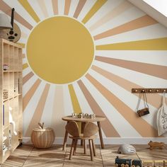 a child's room with sunburst painted on the wall and wooden furniture