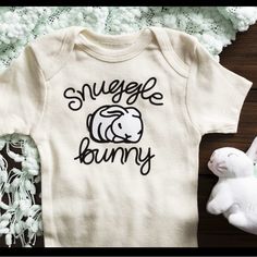 Custom Imprinted Onesie Designs Galore Text Style Galore Colors Available Two Different Mediums Where Used Here Sublimation On The Muted-Softly Water Color Design On Cotton And Vinyl Heat Transfer On Others. Both Are A Cozy Addition To A Baby’s Daily Wear. Baby Onsie Decorating Ideas, Snuggle Bunny, Geometric Lion, Unisex Onesies, Custom Onesies, Nautical Baby, Lettering Style, Baby Body, Baby Grows