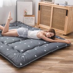 a woman laying on an inflatable mattress